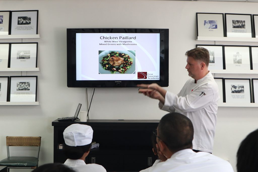 Executive Chef in First Gourmet academy discussing French cuisine